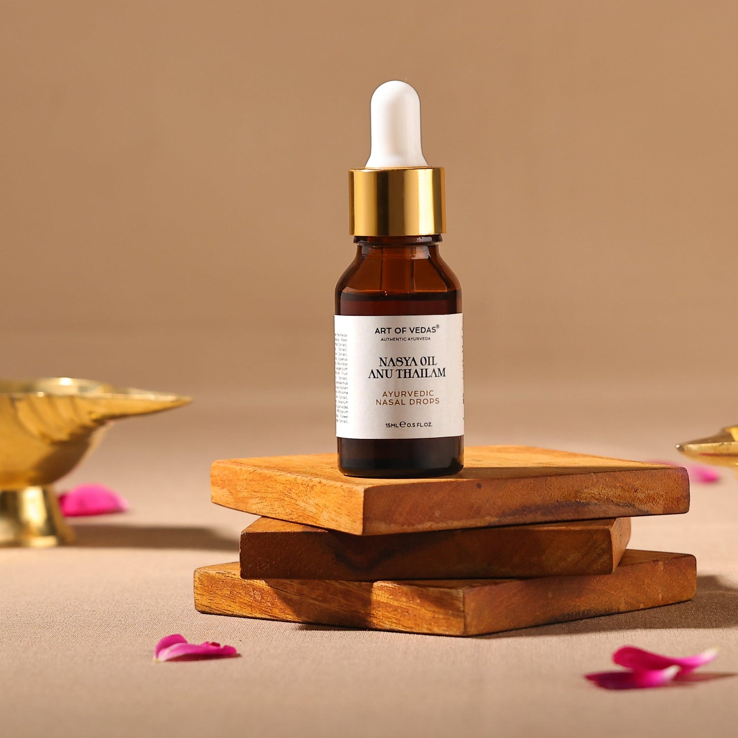 Bottle of Art of Veda Nasya Oil Anu Thailam on wooden blocks with a beige background Photography